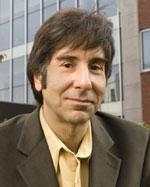 man in a suit posing for a photograph