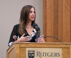 woman speaking behind a podium