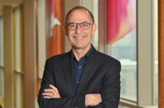 man in a suit posing for a photograph