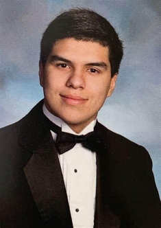 man in a suit posing for a photograph