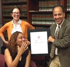 man holding a certificate/award