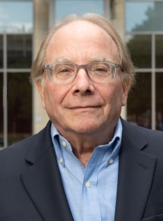 man in glasses grinning