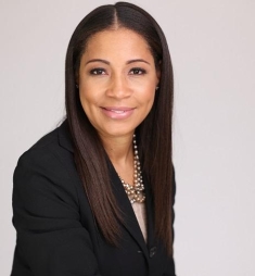woman in a suit posing for a photograph
