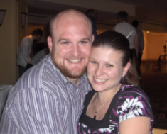 man and woman posing for a photograph