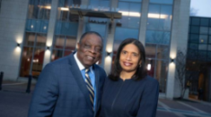 man and woman posing for a photograph