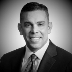 man in a suit posing for a photograph
