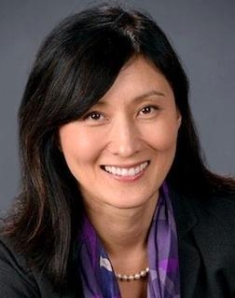 woman in a suit posing for a photograph