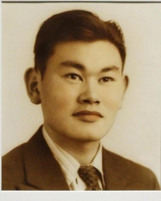 man in a suit posing for a photograph