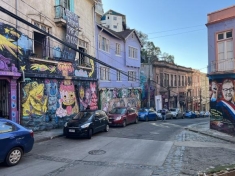 picture of a street with buildings and cars