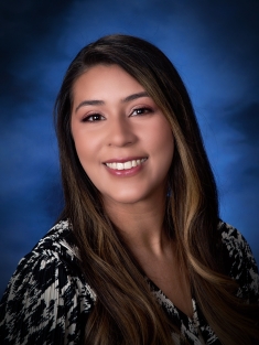 woman smiling against blue background
