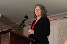 woman speaking at podium