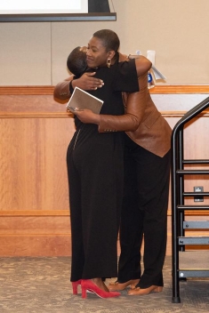 two people hugging each other