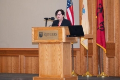 woman speaking into a microphone