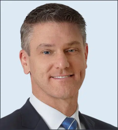 man in suit and tie smiling