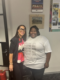 two women smiling side by side
