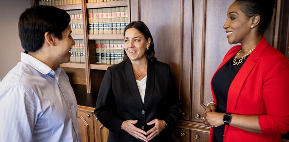 Romero with Saul Molina, a second-year student at Rutgers Law School in Camden who is working as a legal assistant in the U.S. Attorney’s Office, at left, and Angella Middleton CLAW’15, an assistant U.S. attorney.
