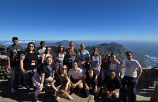 students posing on table mountain in south africa