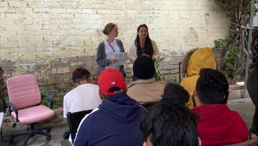 Emily Rathburn '23 & Paralegal Sylvia Santos giving a charla at the border.